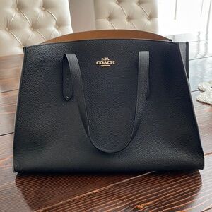 Coach tote- black center zip pocket and 2 small phone sized pockets